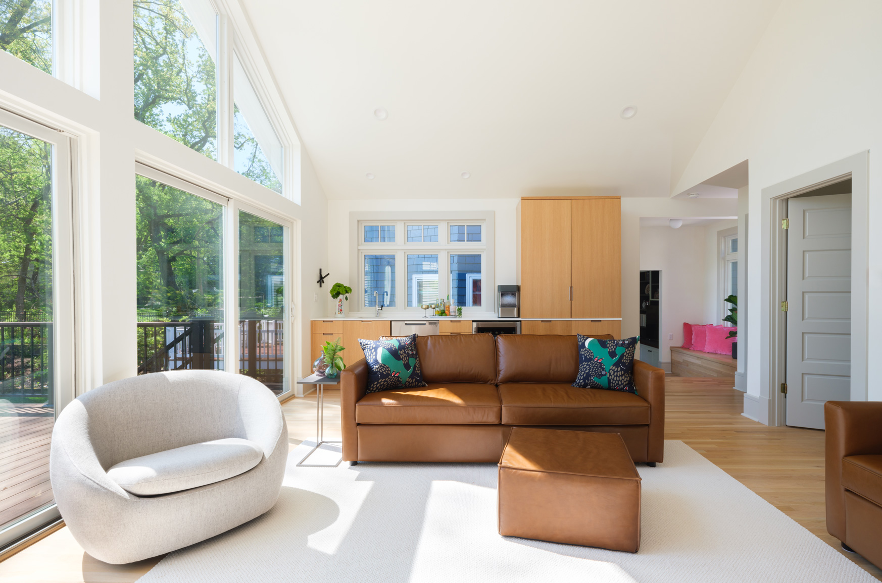 Living room with vaulted ceilings and expansive windows in Webster Groves, Missouri — design build firms St. Louis